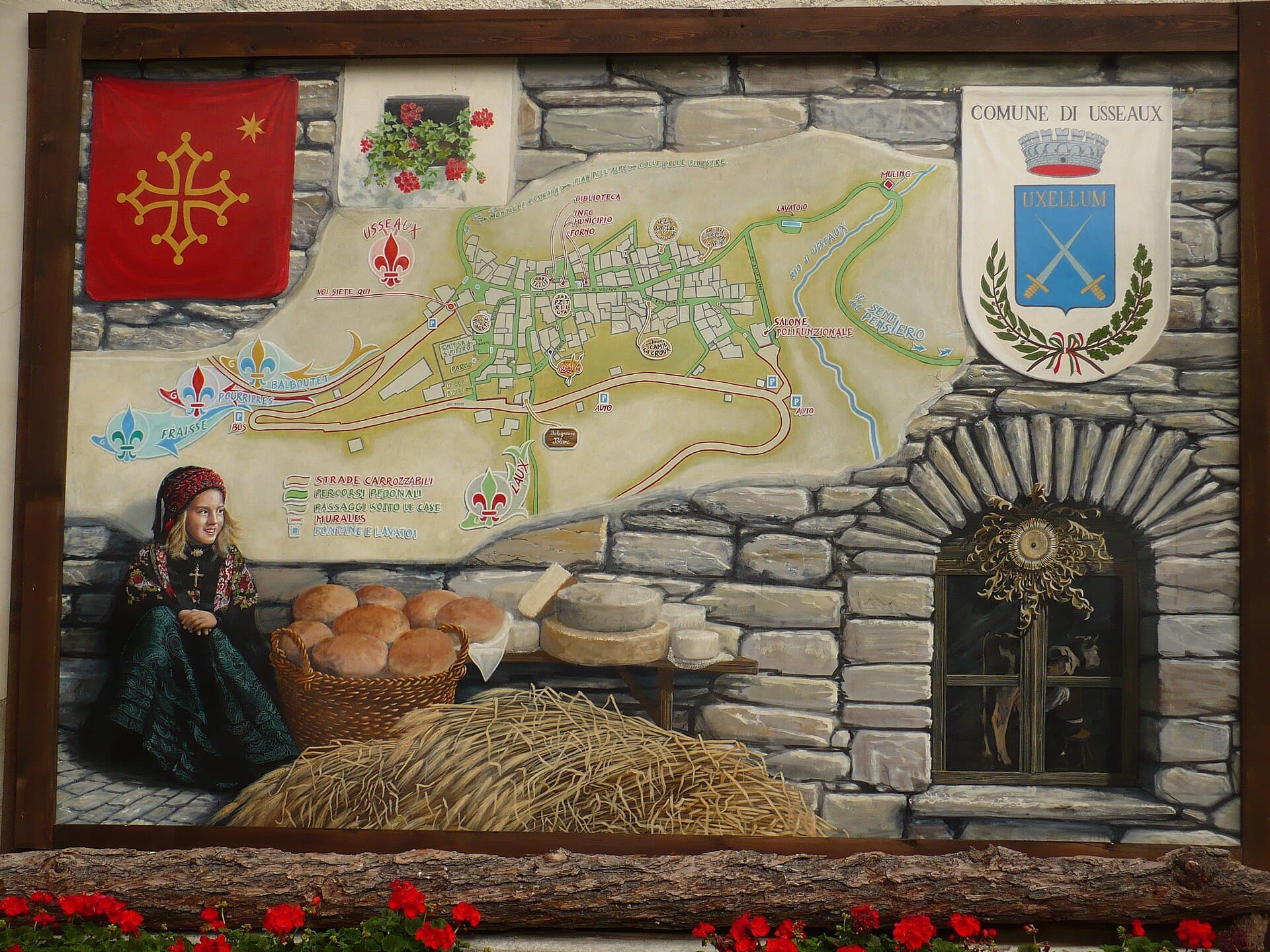 Un murale dipinto su una casa di Usseaux, borgo alpino della Val Chisone